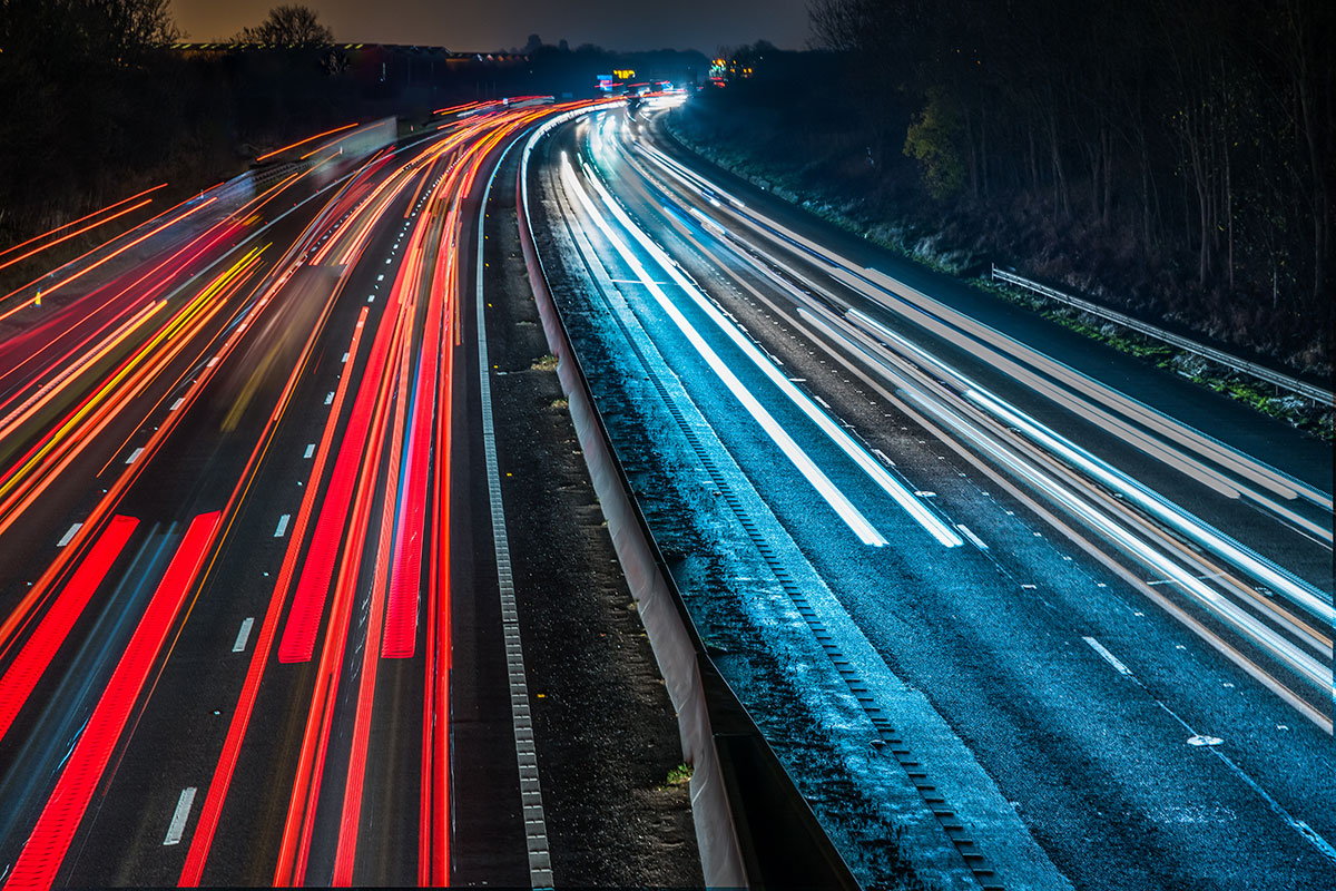 Motorway at night with light trails